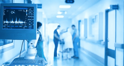 A blurry photo of people in the hospital.